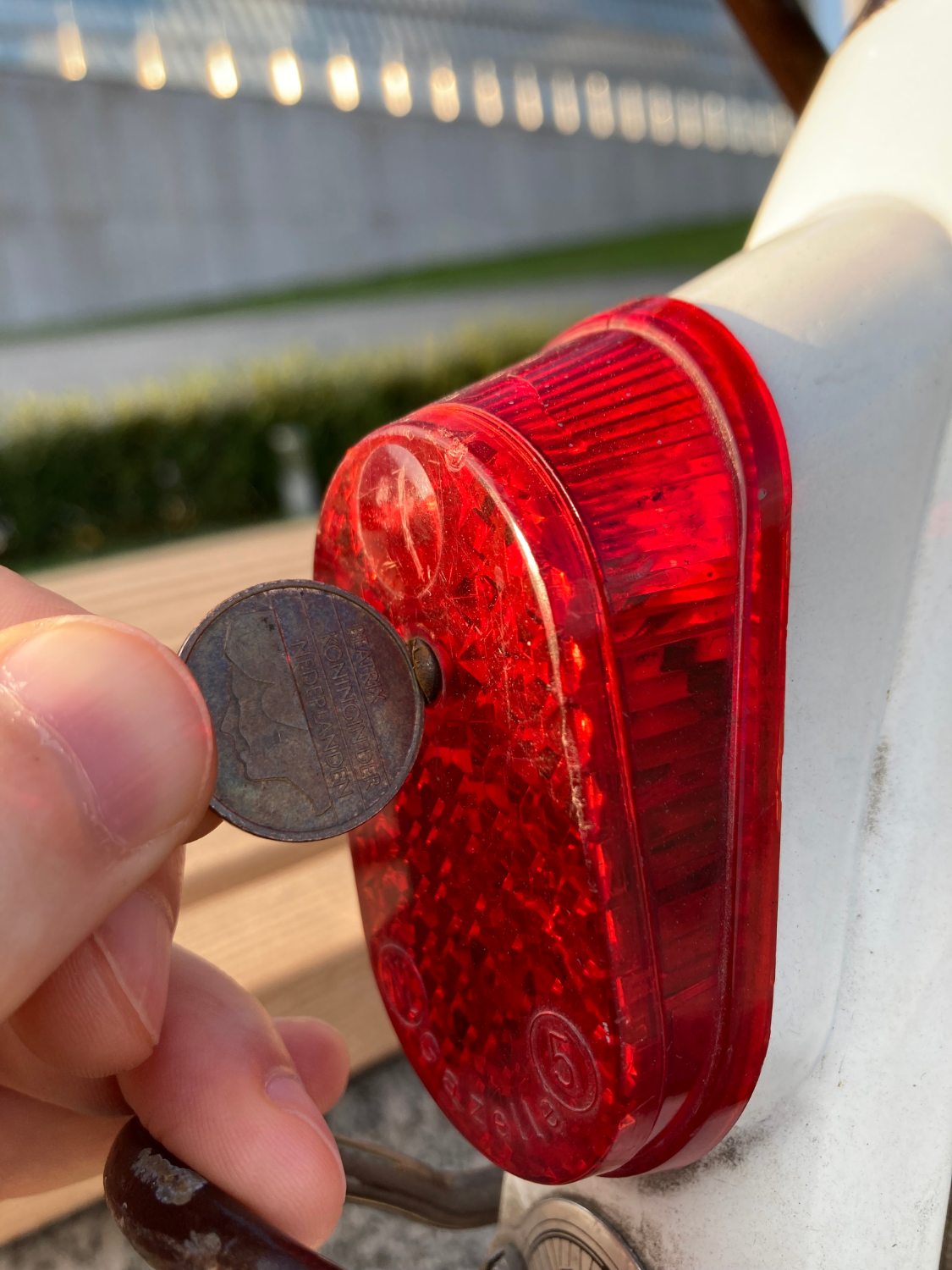 A coin is used to open the lantern.